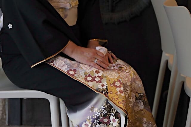 A woman wearing a kimono in a formal setting